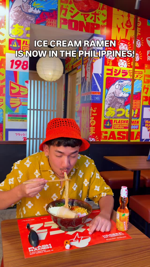 Flash Ramen guest enjoying a bowl inside the vibrant Japanese-themed restaurant